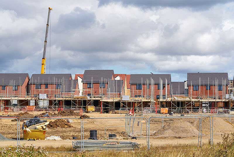 Wide shot of houses under construction